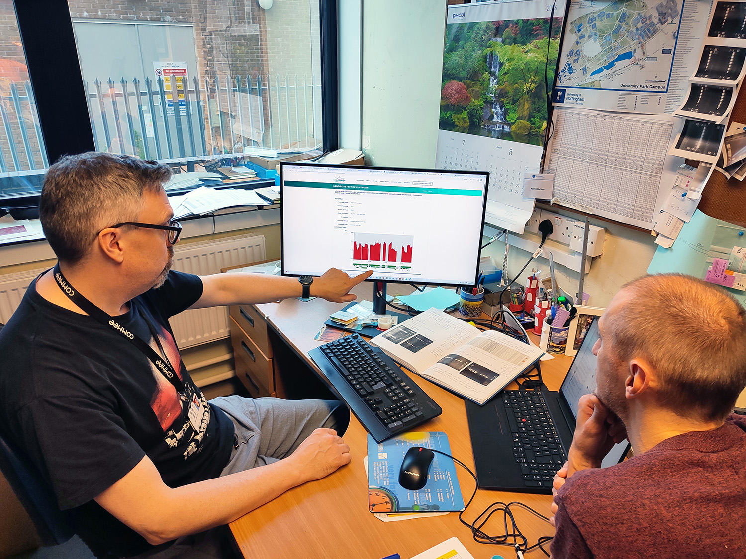 Patrick McClure, Assistant Professor at the Faculty of Medicine & Health Sciences (left), discussing results generated by Genome Detective (image by University of Nottingham)
